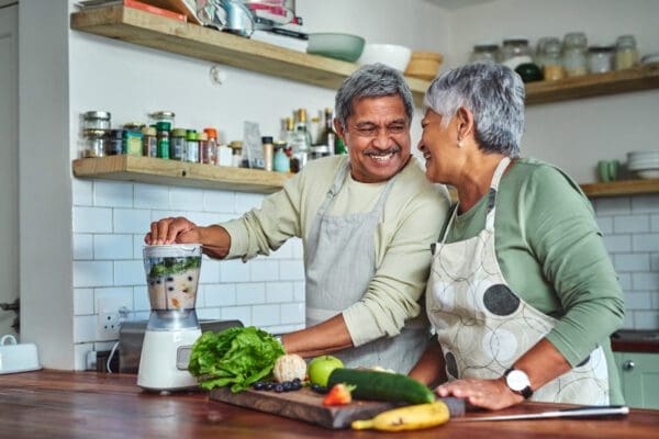 Shot of a senior couple preparing a healthy smoothie in the kitchen at home