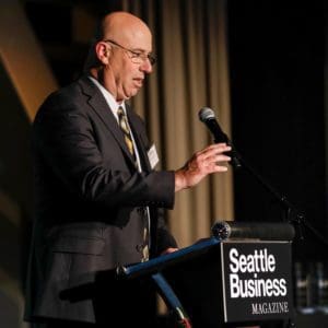 Jeff at the podium of Seattle Business
