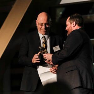 Jeff accepting award at Seattle Business