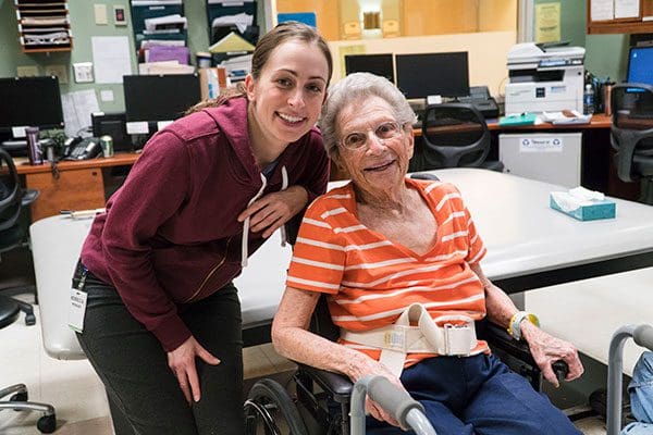 Nurse smiling with a rehabilitation patient at Kline Galland Home in Seattle