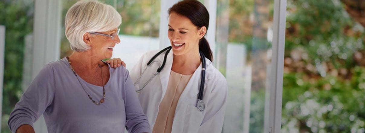 Nurse smiling at patient