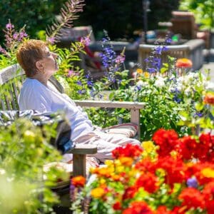 Woman enjoying the sun on rooftop garden