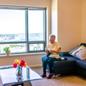 Woman reading book on couch