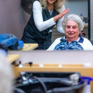 Resident getting her hair done
